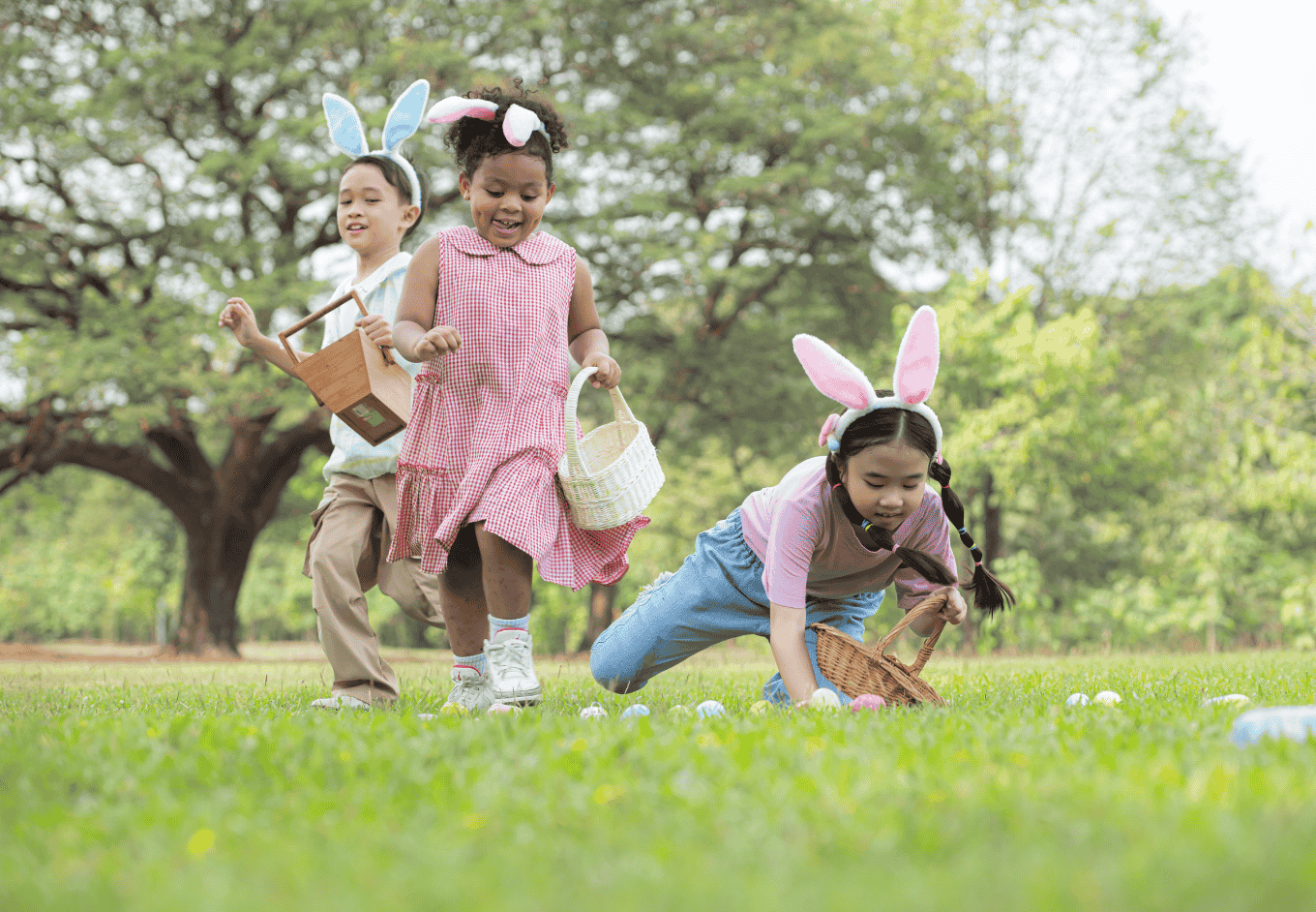 Children enjoying outdoor activities in the park including a run to collect beautiful Easter eggs.