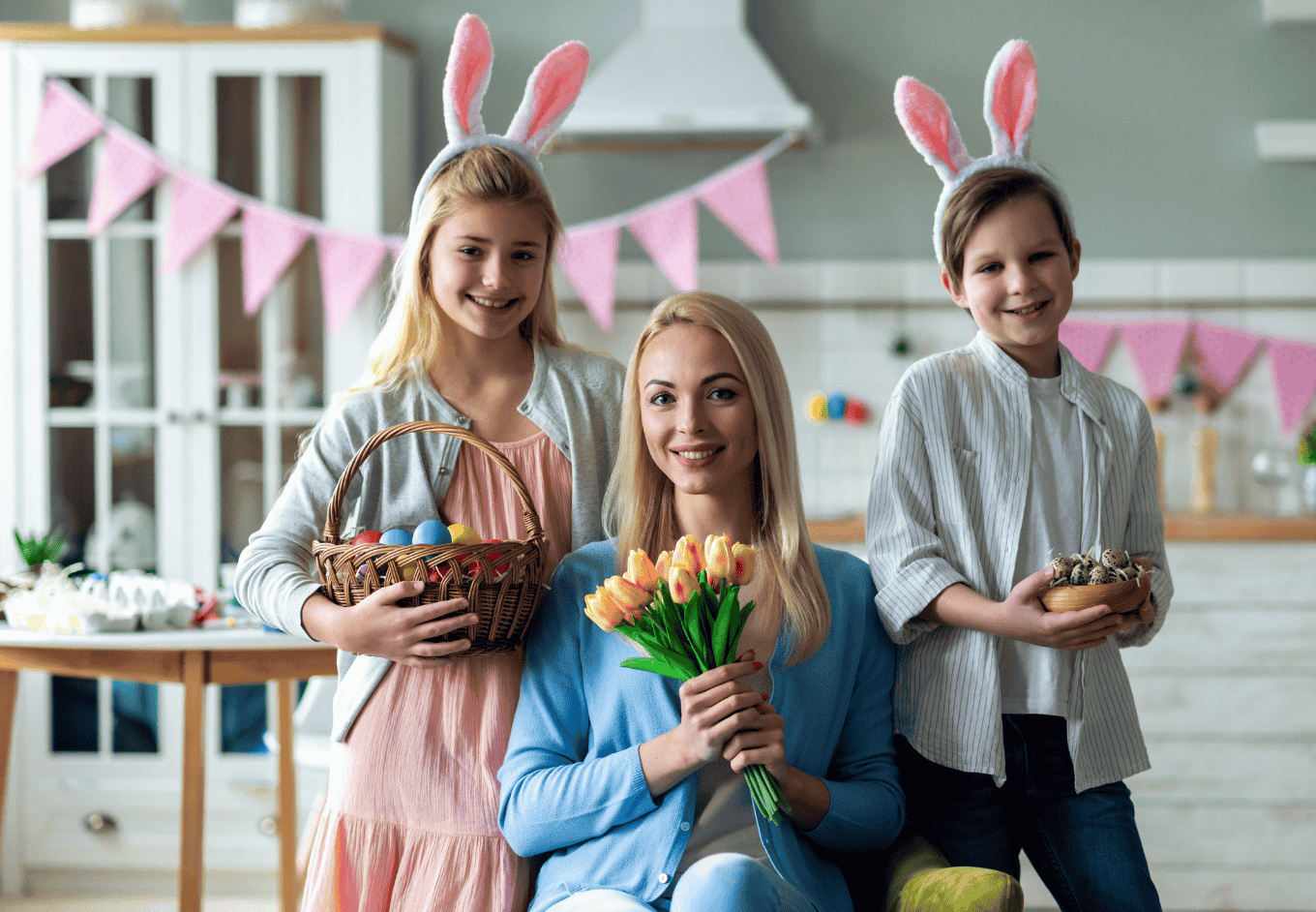 Family Celebrates Easter with Flowers and Decorated Eggs