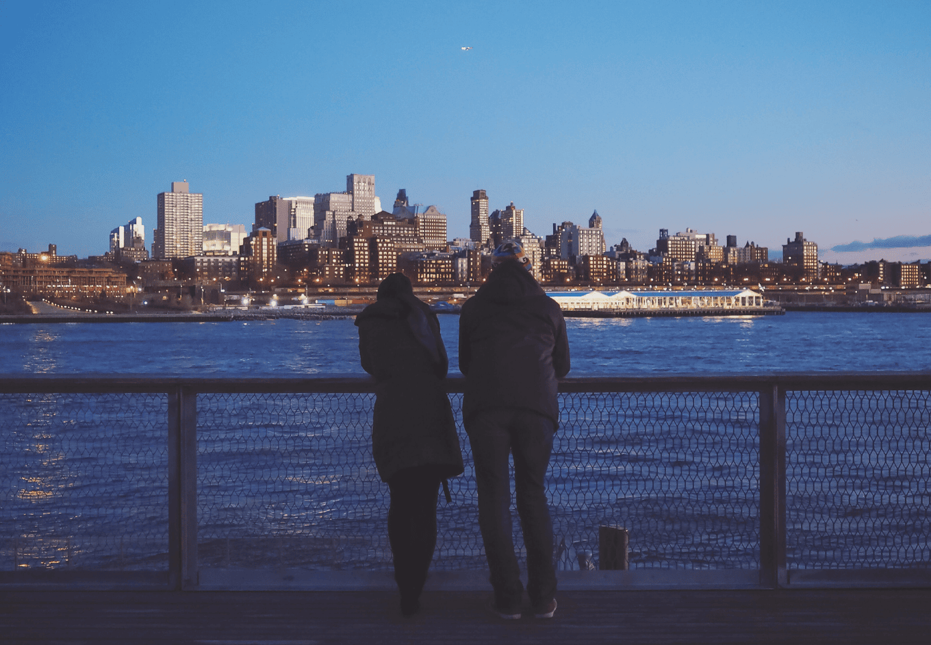 Woman and man looking at the city