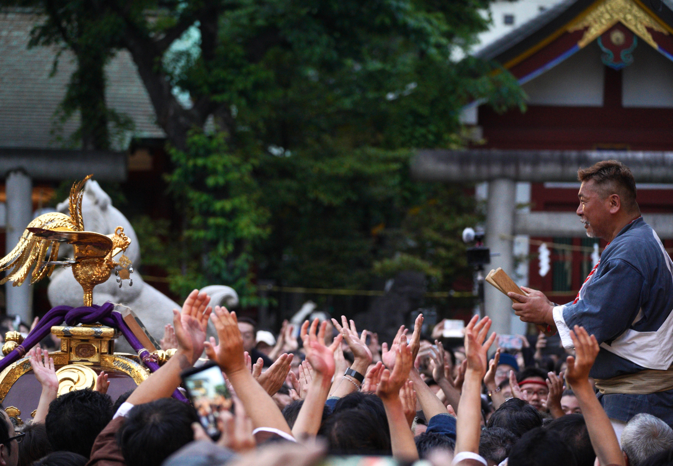 Japanese enthusiastic festival goers clapping hands in Tokyo