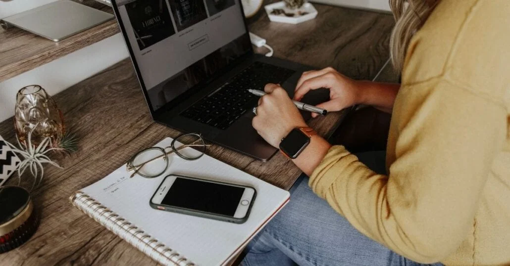 Young woman working from home on her laptop.