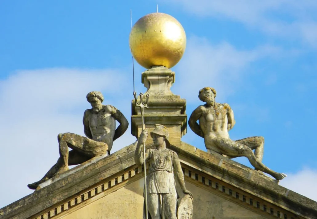 a close up view of three states and a golden sphere 