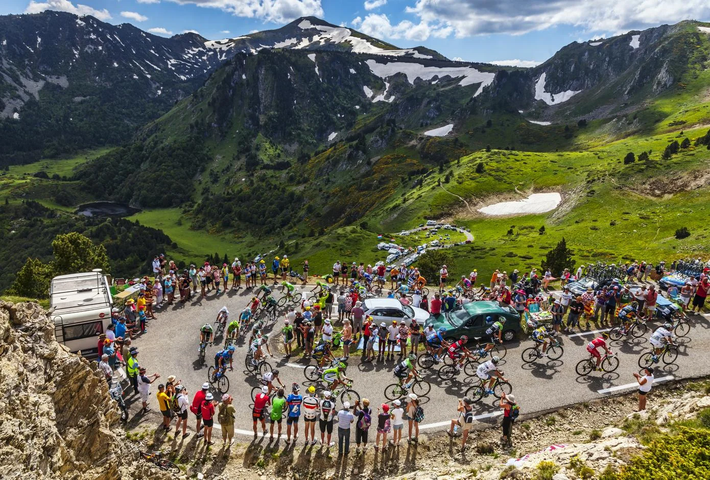 The peloton climbing the road to Col de Pailheres in Pyrenees Mountains during the stage 8 of Tour de France, 2013. 