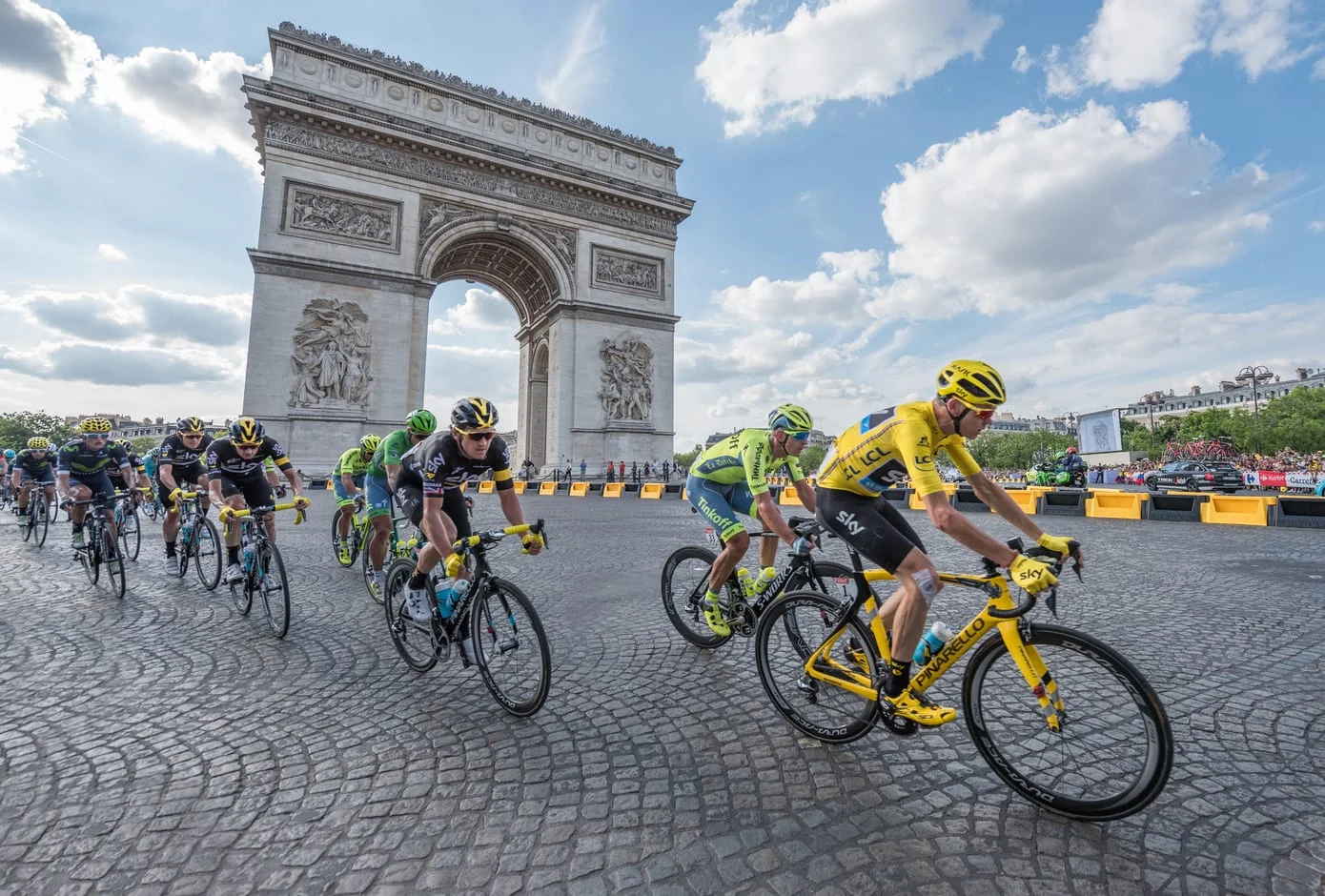Christopher Froome, wearing the leader's yellow jersey in front of Arc de Triomphe during the Tour de France on the Champs Elysees Avenue. 