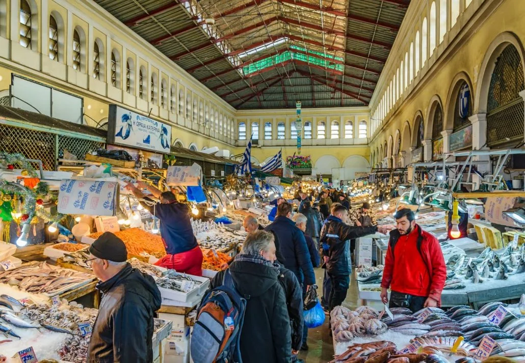 Picture of people shopping in a market in Greece