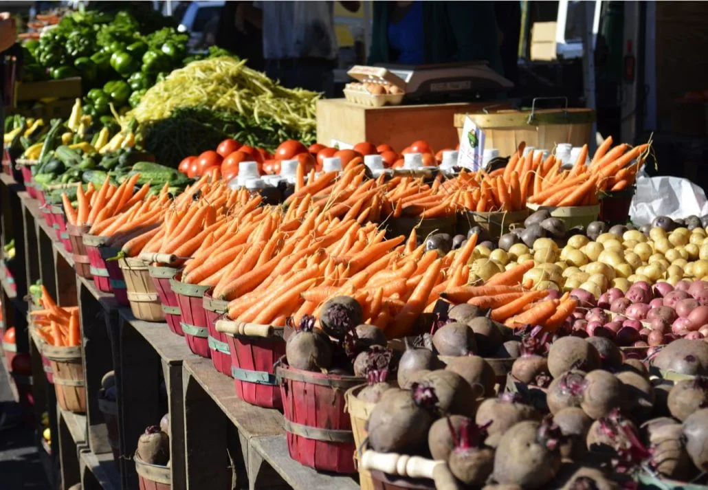 Various vegetables showcased on a table at the farmer's market