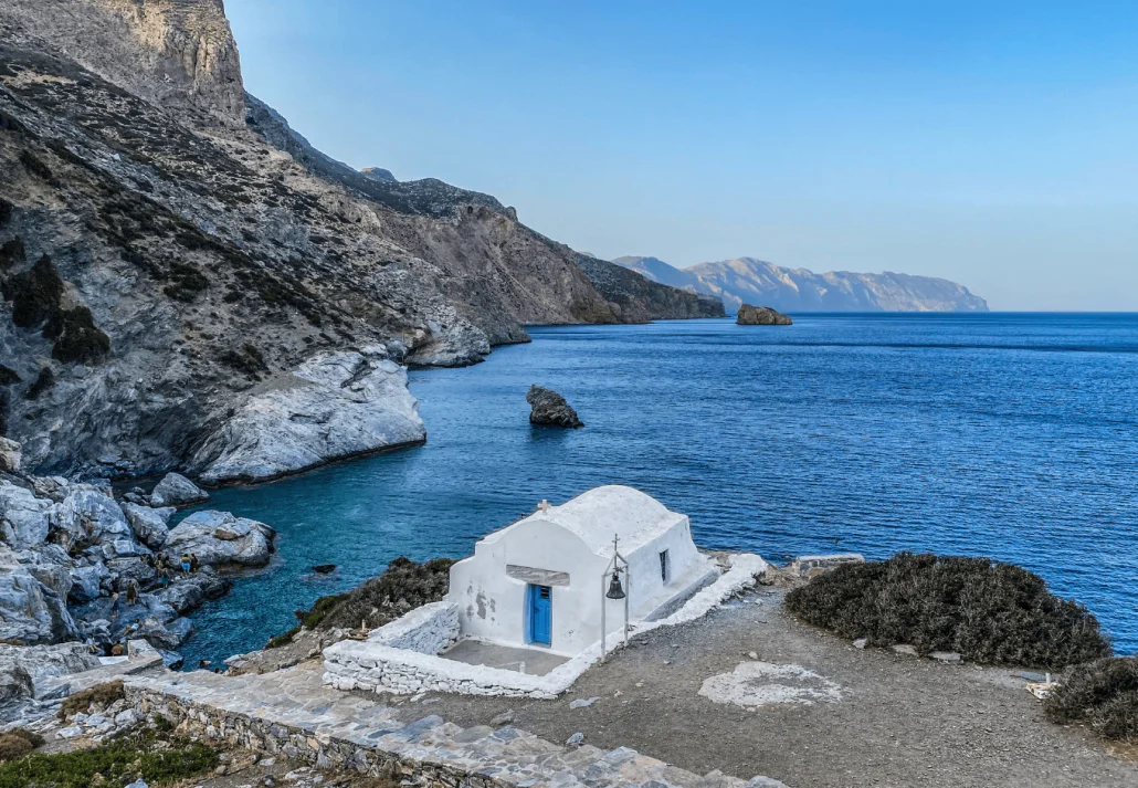 beach with its small white chapel at Milos
