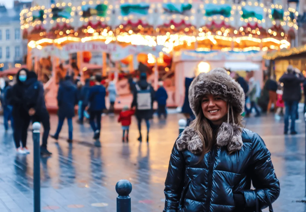 Portrait of a young woman in a winter hat,in full light of the city.Winter season, winter fashion