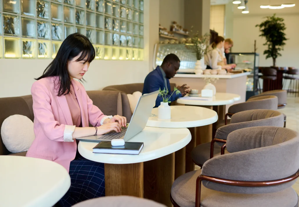 woman-with-laptop-sitting-at-cafe