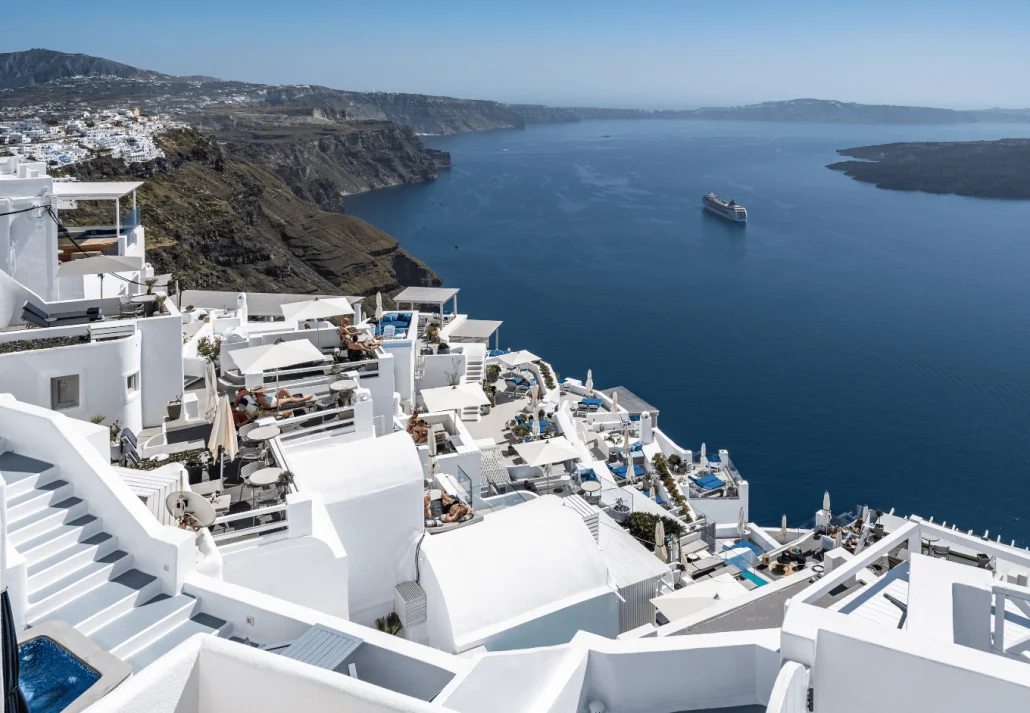 Typical white washed greek buildings in Santorini overseeing the caldera in Greece
