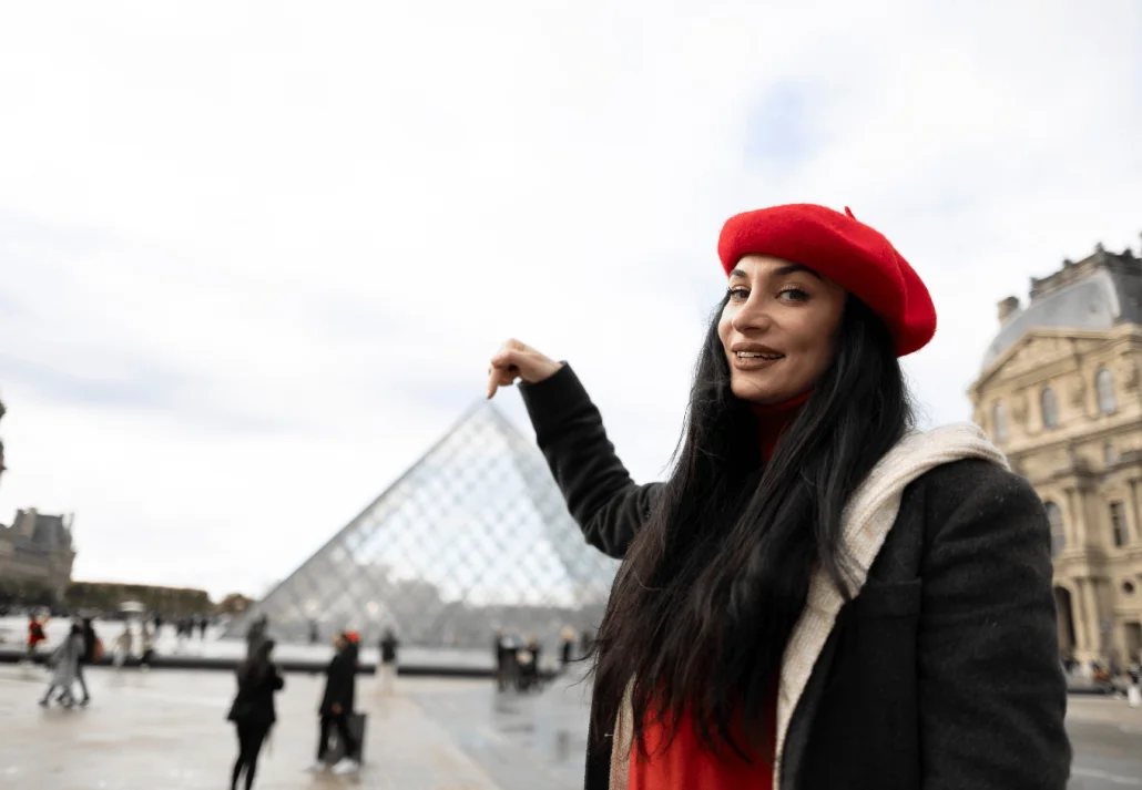 a pretty tourist woman with a red bonnet, she is in France, Paris best european cities to visit 