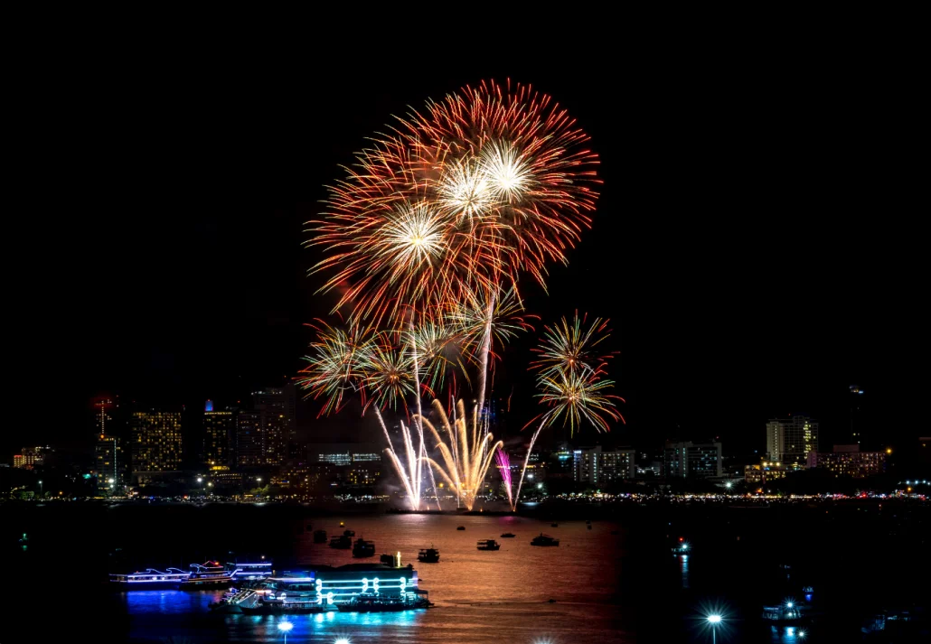 Firework blast in dark sky at night