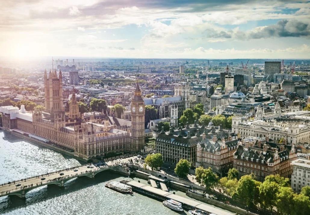 Best time to visit London - Aerial view of London with top landmarks like the River Thames, the Big Ben and the London Parliament Building.
