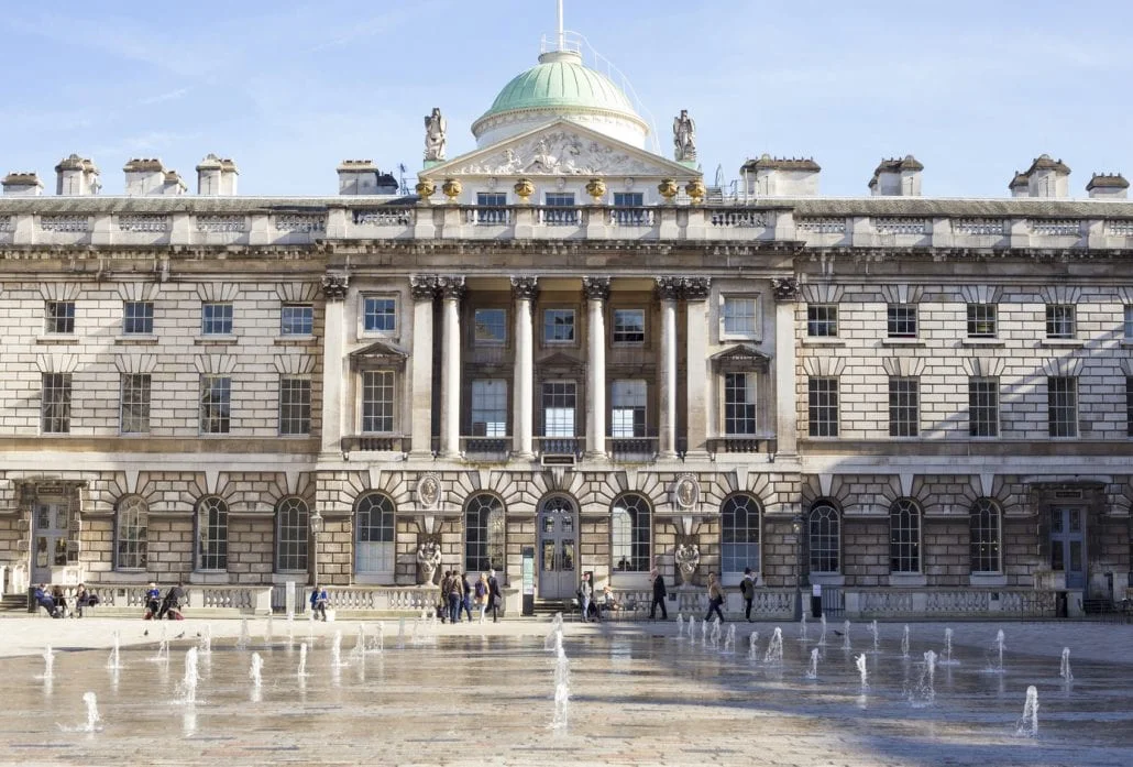 London Attractions - the Somerset House and its dancing spurting water fountains in London, UK on a sunny day.