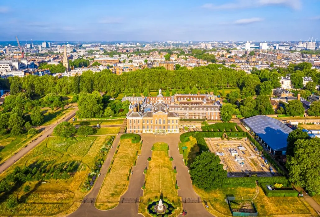 London Attractions - The Kensington Palace and its ornate gardens viewed from the top.