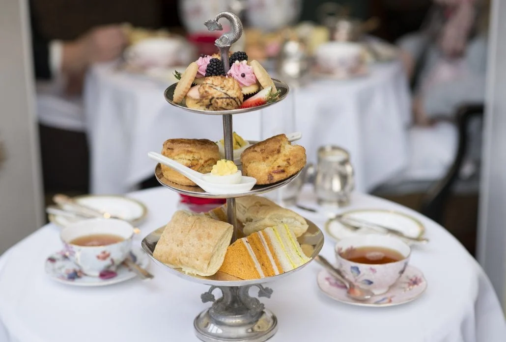 London Attractions - A typical British Afternoon Tea with scones, finger sandwiches and pastries.