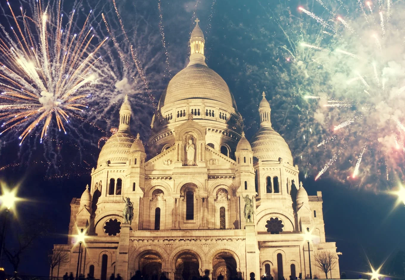 The Sacre Coeur church with fireworks, during the New Year in Paris, France 