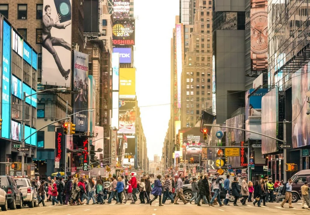 People crossing New York's Seventh Avenue.
