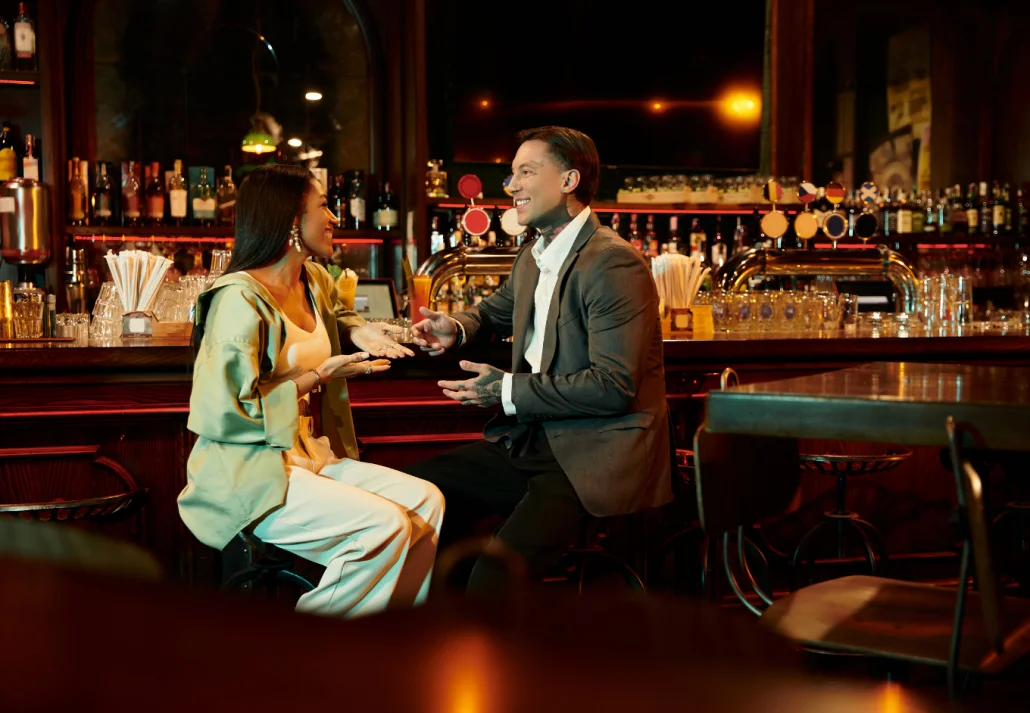 Young couple enjoying a lively date night at a trendy bar setting