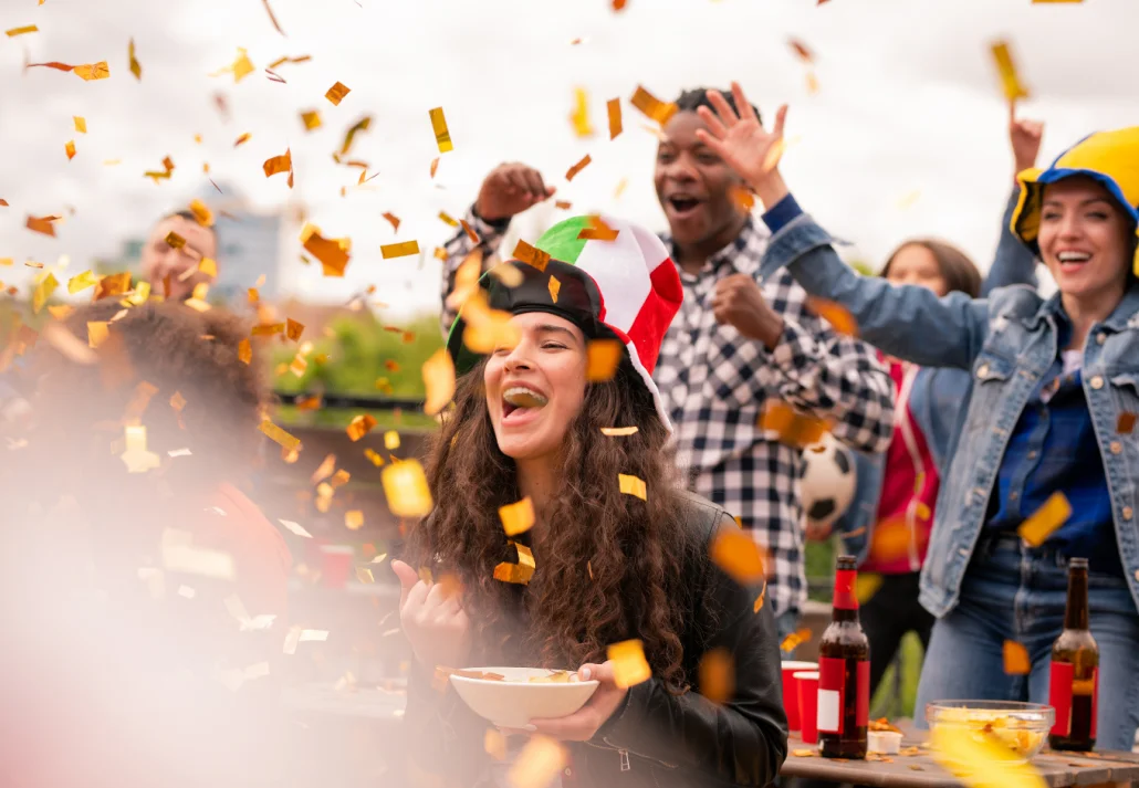 Joyful multicultural girls and guy expressing joy while shouting ecstatically