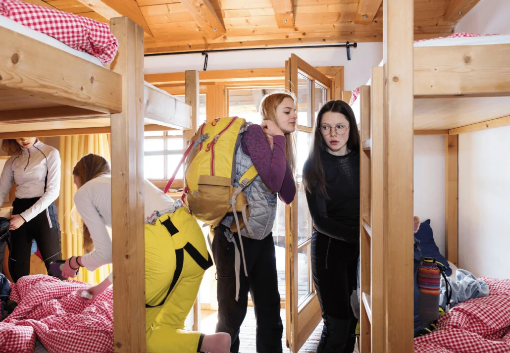  Four teenage girl getting ready in a female only dorm